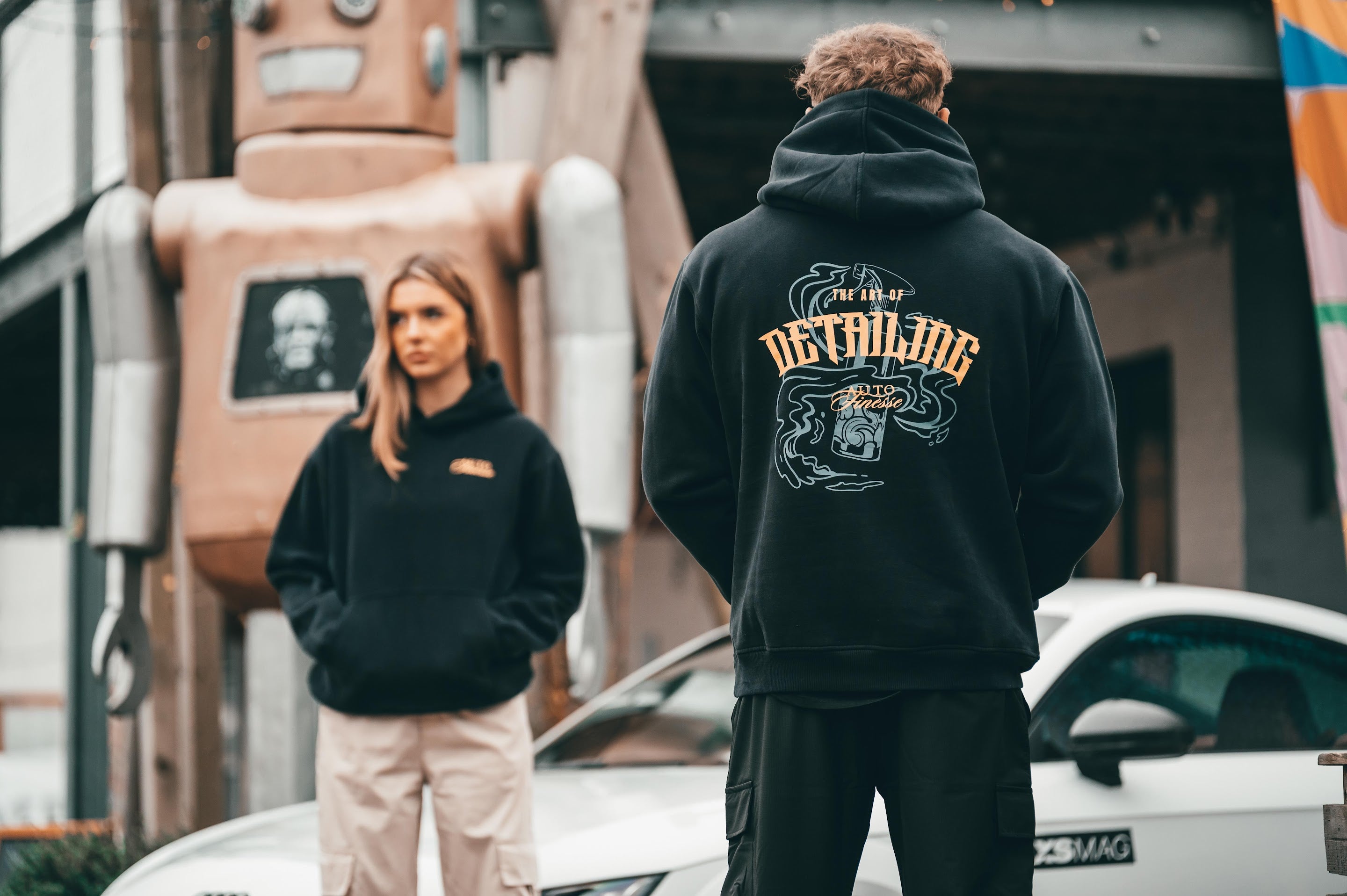 Man & Woman Wearing Auto Finesse Hoodie