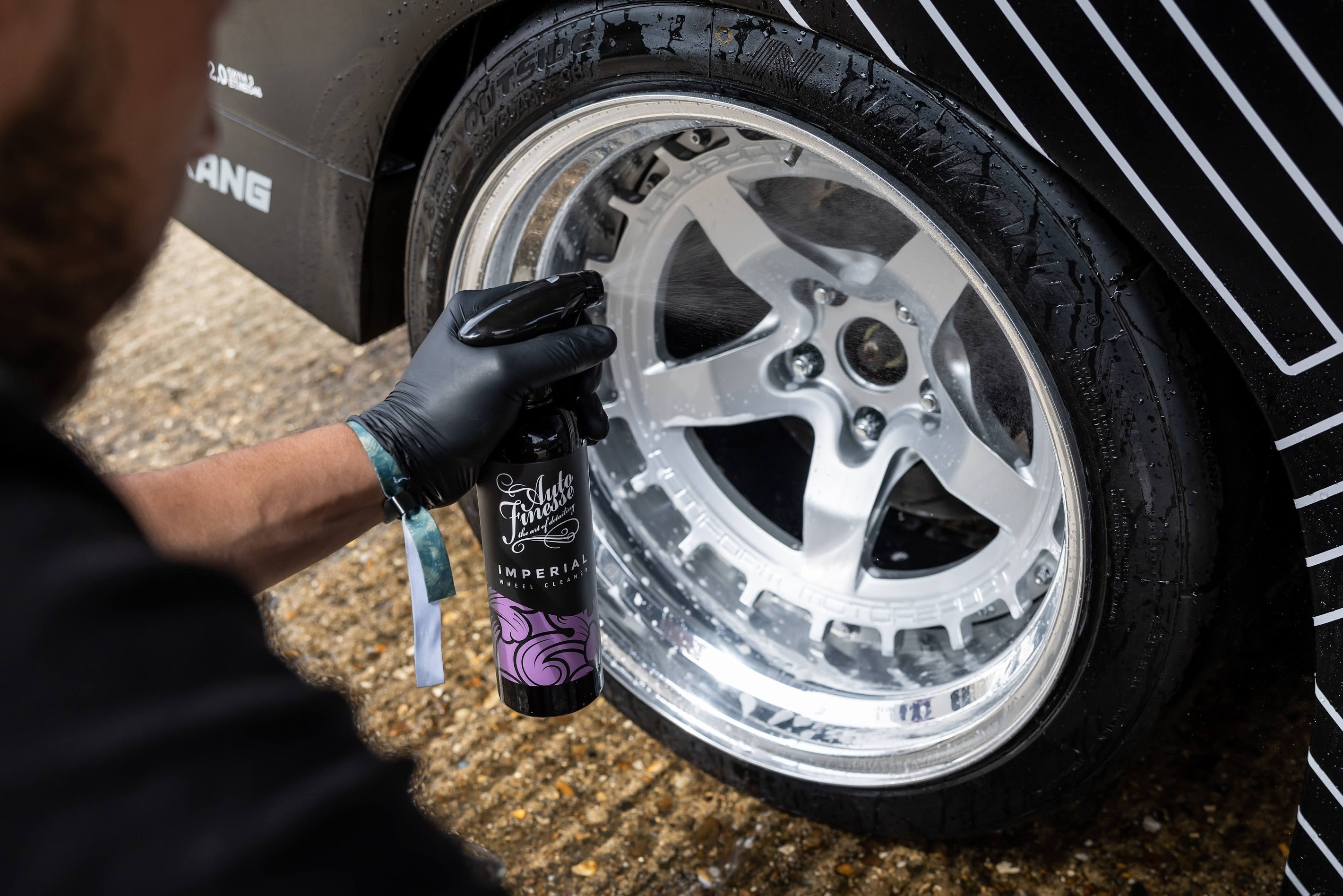 Spraying Imperial Wheel Cleaner on Wheel