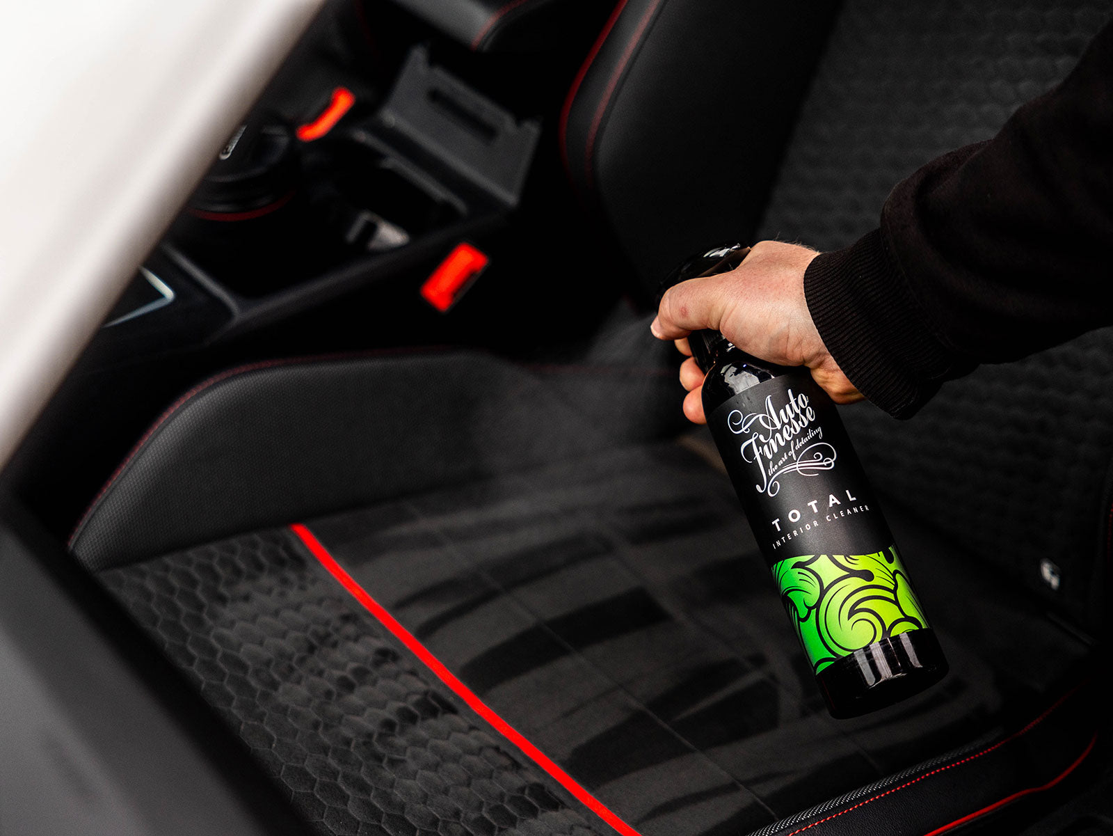 Spraying Total Interior Car Cleaner