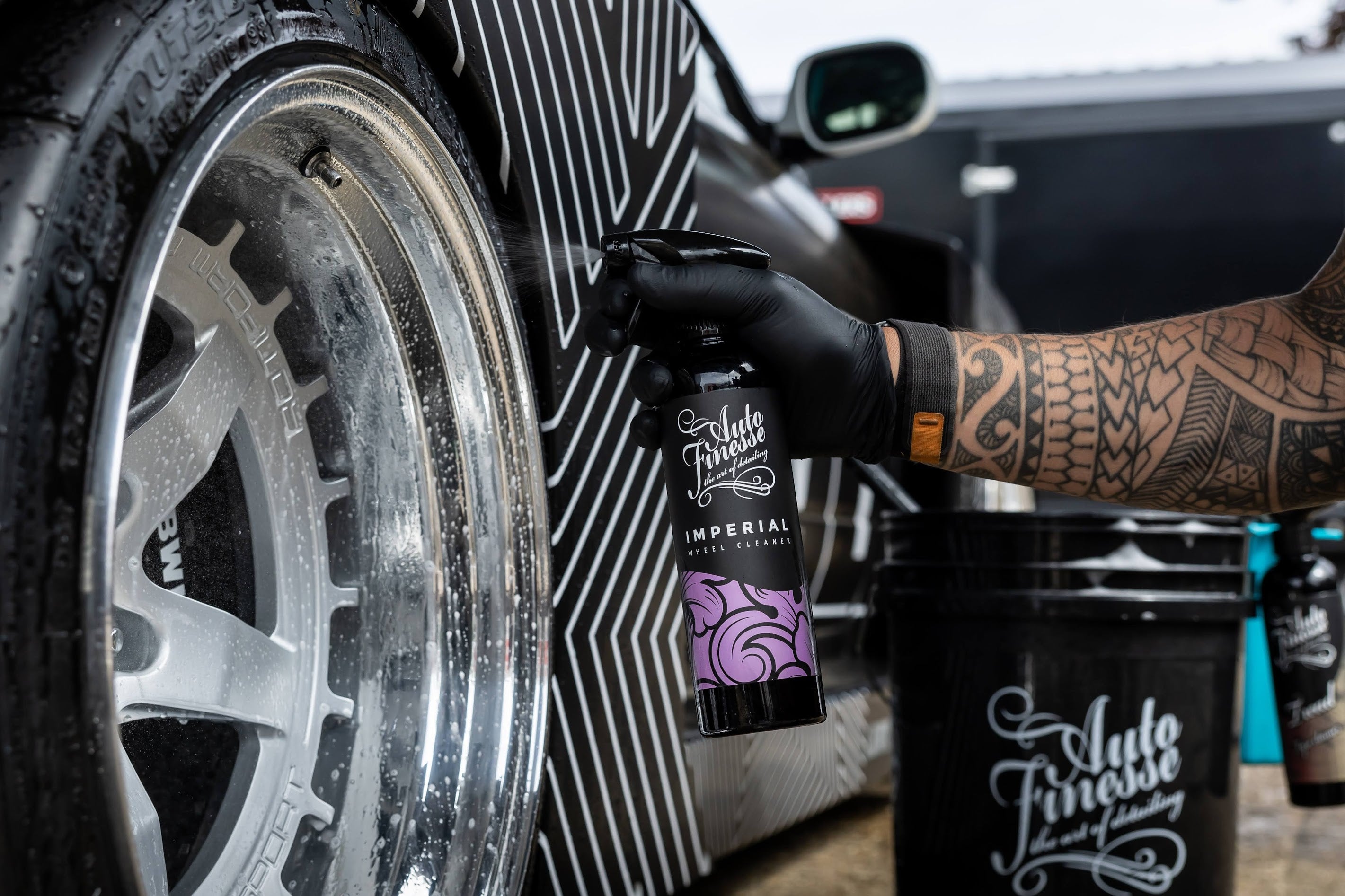 Spraying Imperial Wheel Cleaner on Wheel